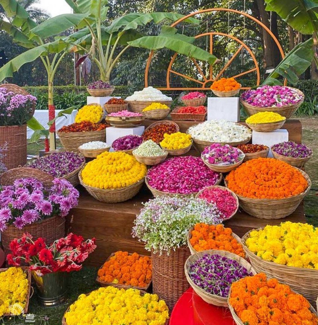 Baskets of marigold, jasmine, roses and mixed petals arranged for styling