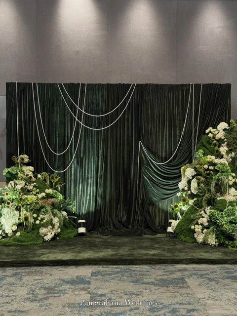 Green velvet and pearl welcome-dinner backdrop at JW Marriott Golfshire