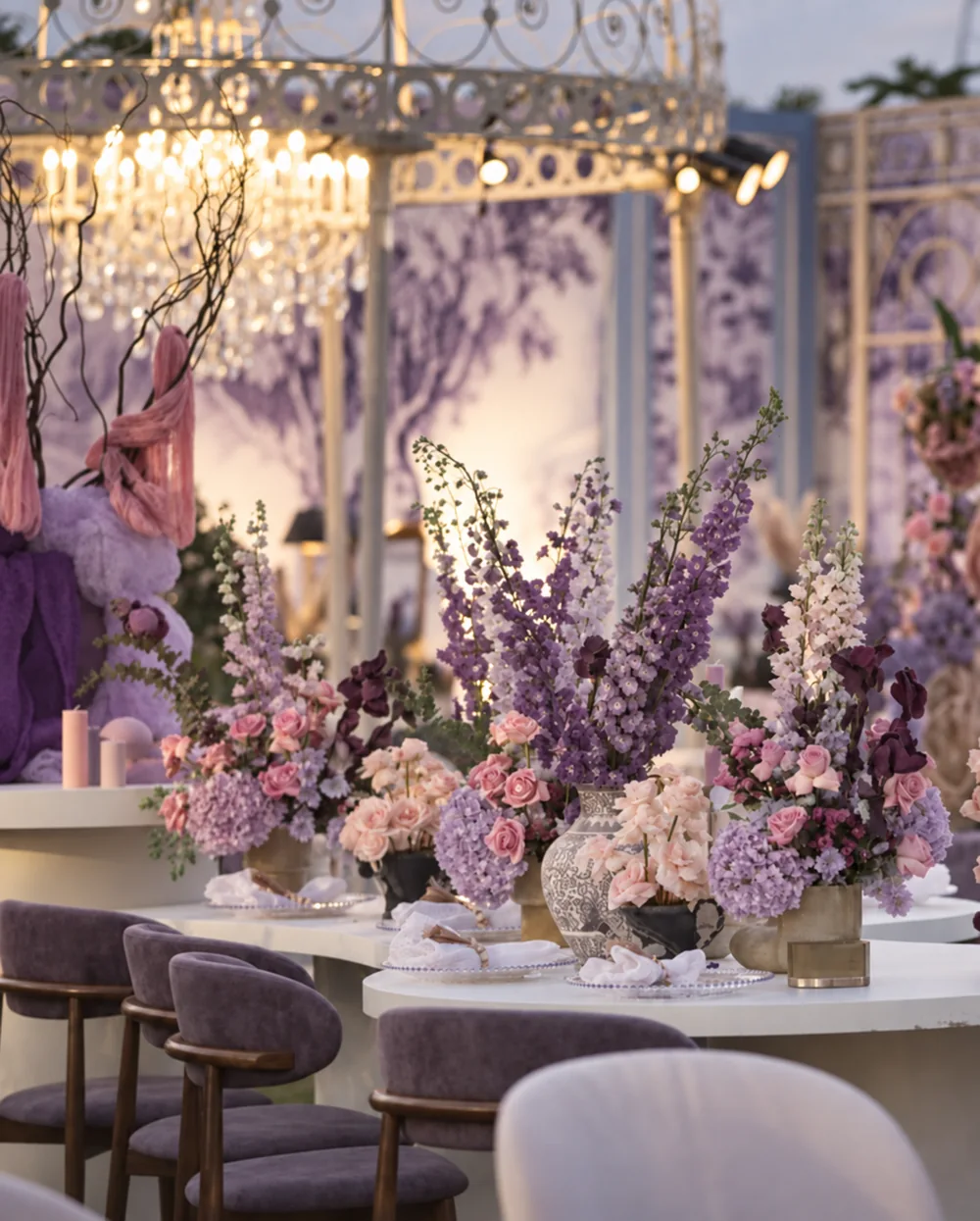 Lavender and blush flowers across curved dining tables at Amitarasa, Bangalore. Decor execution by Panigrahana Weddings.