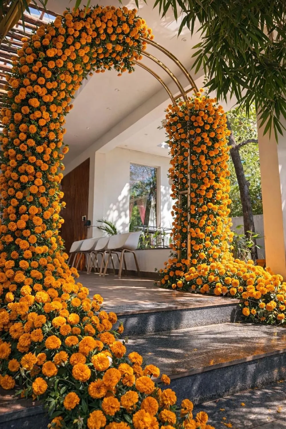 Cascading marigolds around an entrance arch — Panigrahana decor portfolio