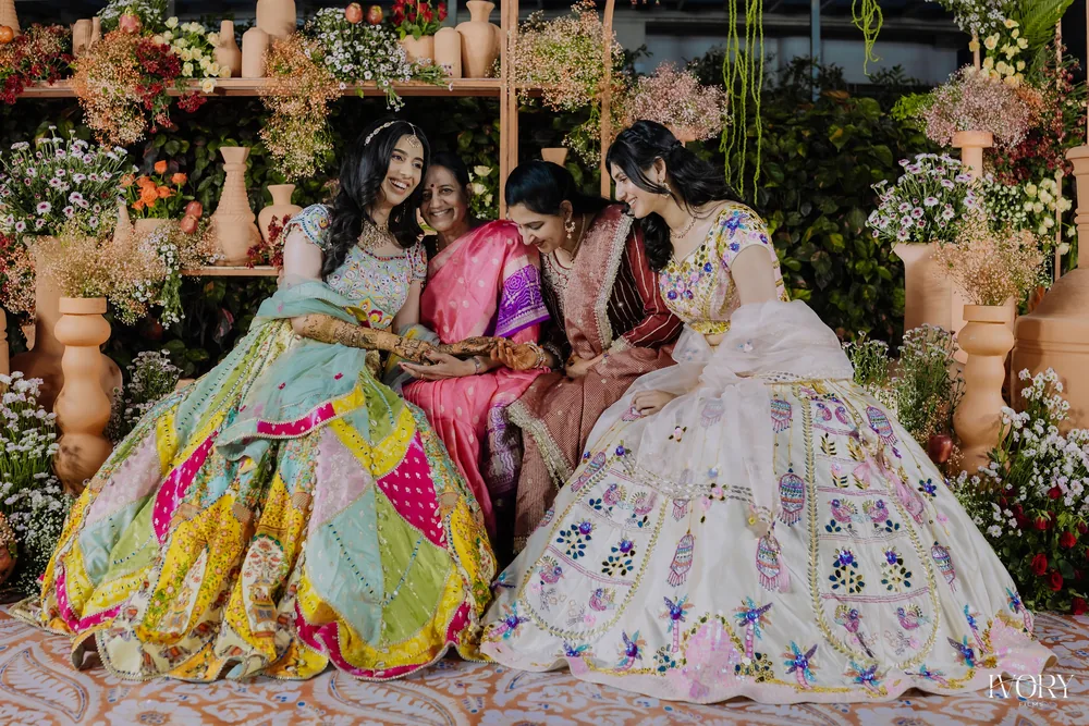 Family celebration against the floral mehendi backdrop — Panigrahana decor portfolio
