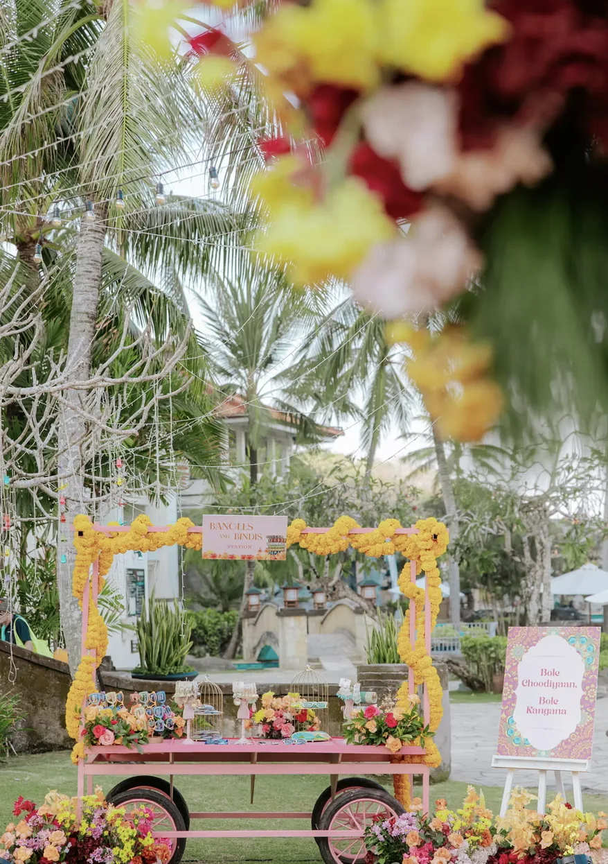 Floral garden cart beneath hanging garlands at Hilton Bali — Panigrahana decor portfolio