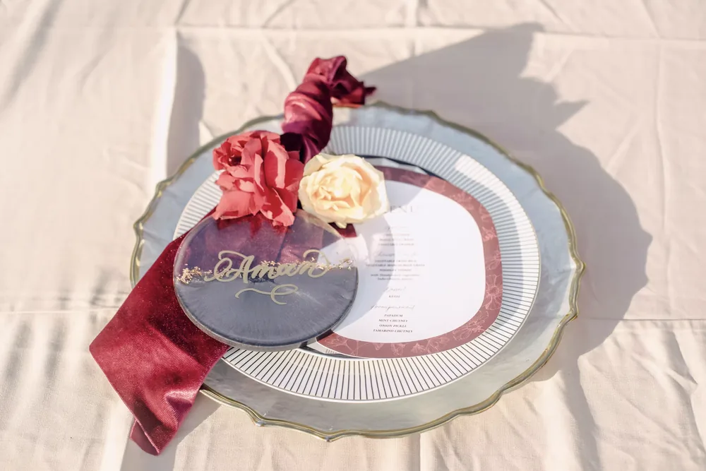 Layered plates with a rose-coloured napkin at Phalosa Villa Bali — Panigrahana decor portfolio