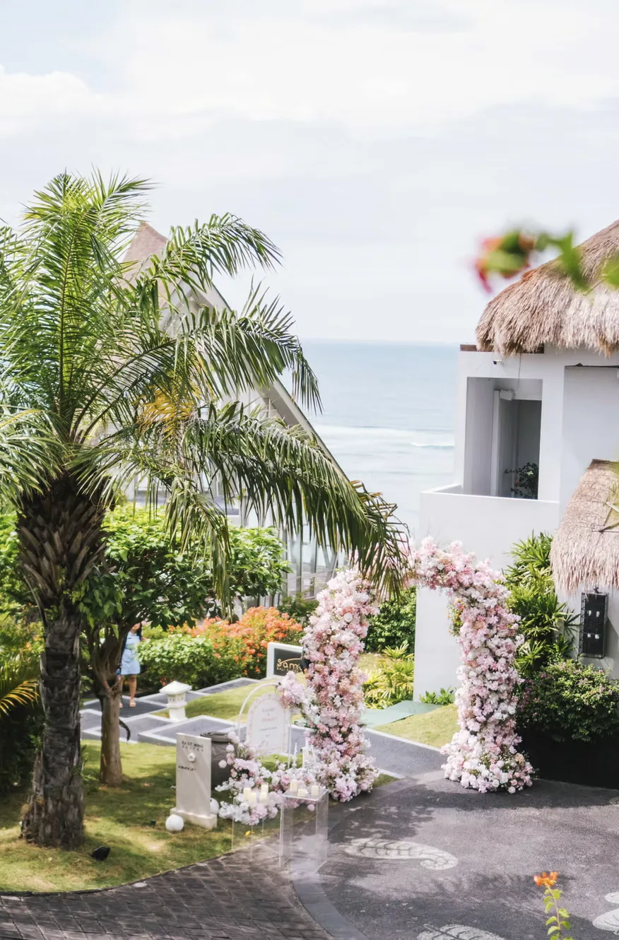 Garden path leading to a pink floral mandap at Samabe Resort — Panigrahana decor portfolio