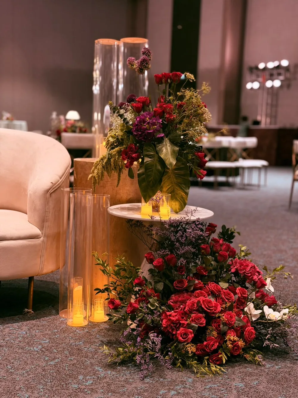 Red rose cascade at a marble side table — Panigrahana decor portfolio