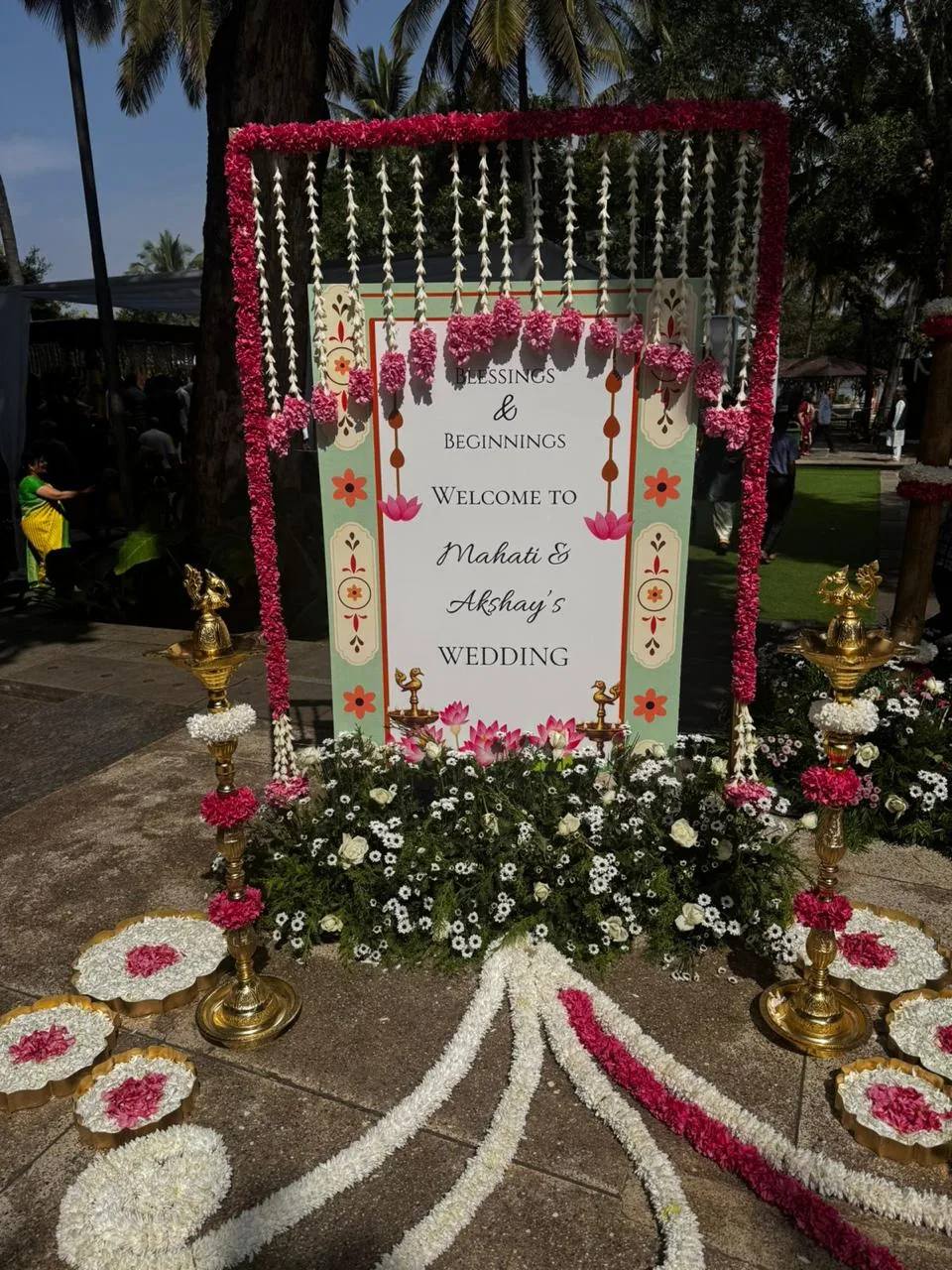 Welcome frame with white and pink flowers at Moongate