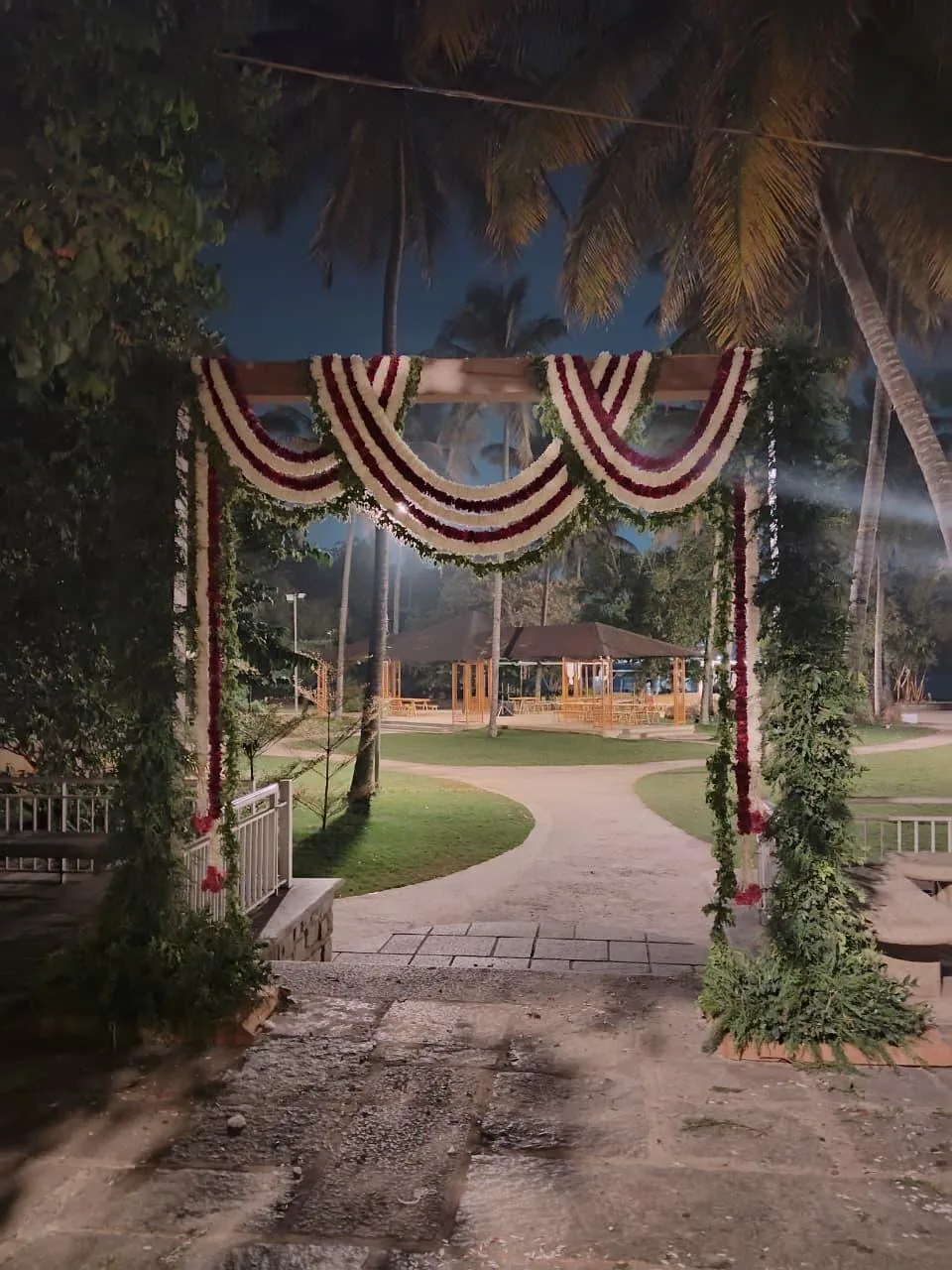 Garland-draped garden entrance at Moongate