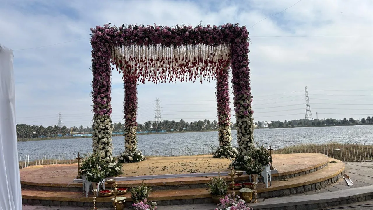 Completed Panigrahana wedding · lakeside floral mandap, not standard inclusions