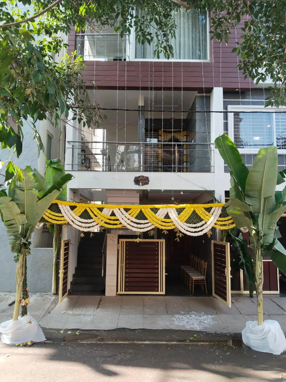 Yellow and white garlands at the entrance at Moongate