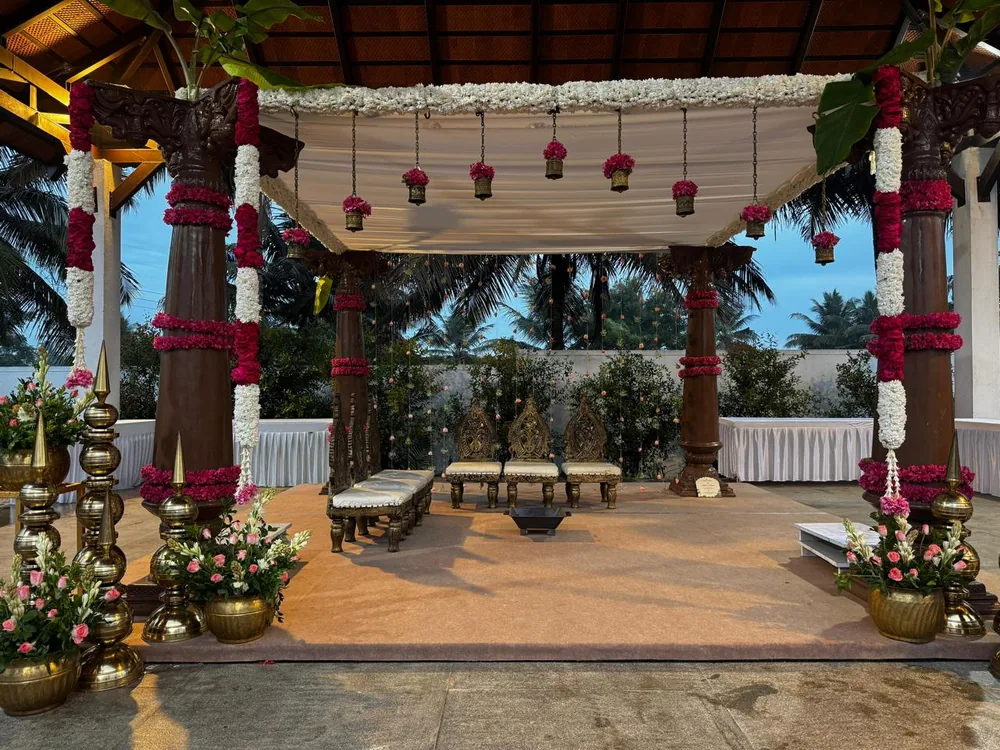 Greenery-wrapped pavilion with floral garlands at Mandara