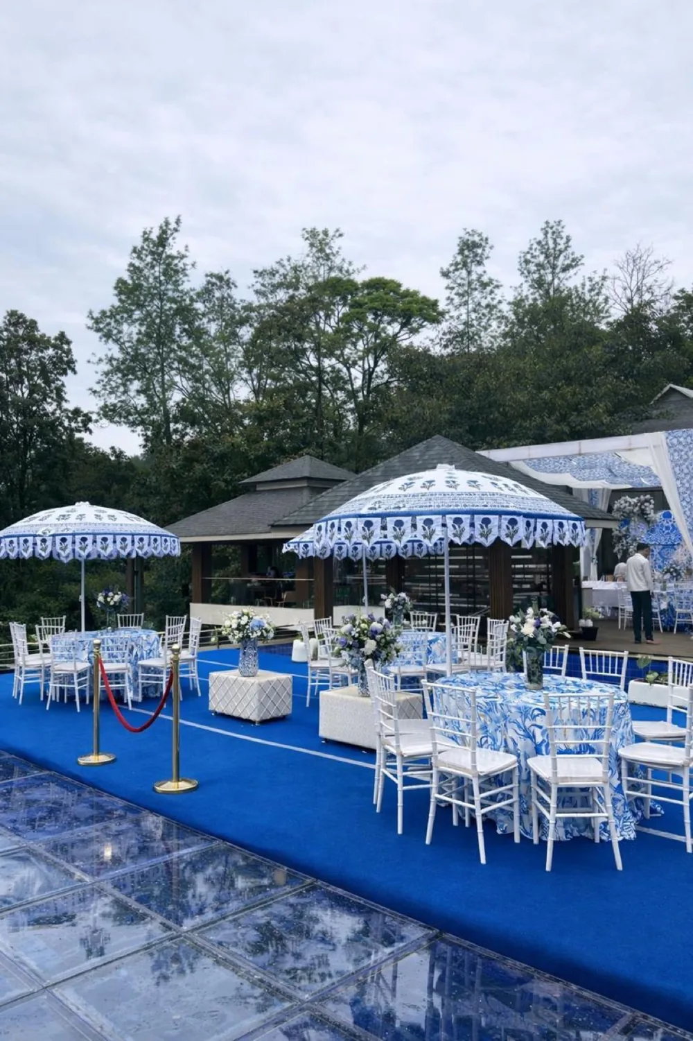 Blue patterned parasols and outdoor wedding seating — Panigrahana decor portfolio