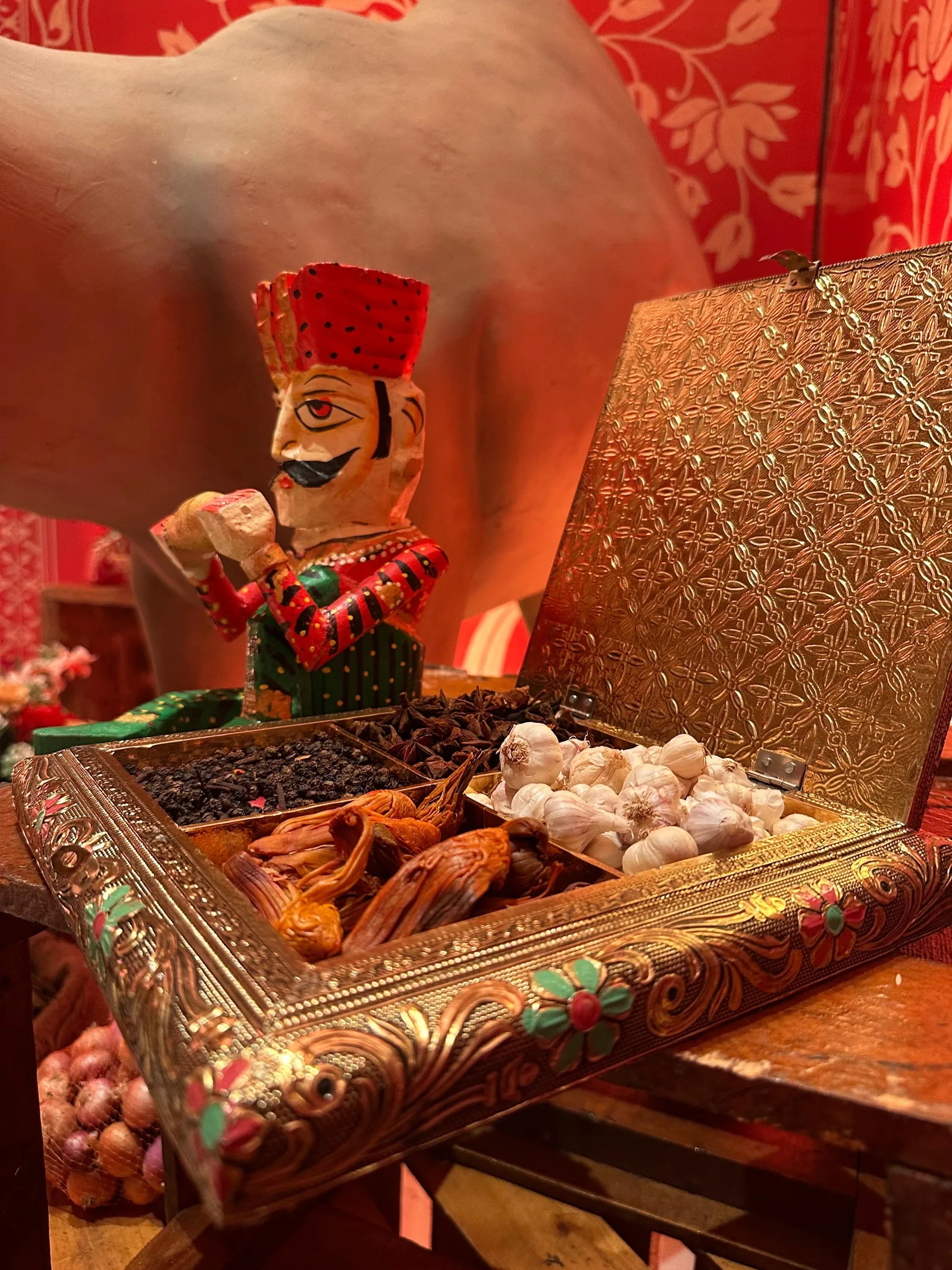 Decorative tray and miniature figures at the Sufi Night entrance at The St. Regis Goa Resort