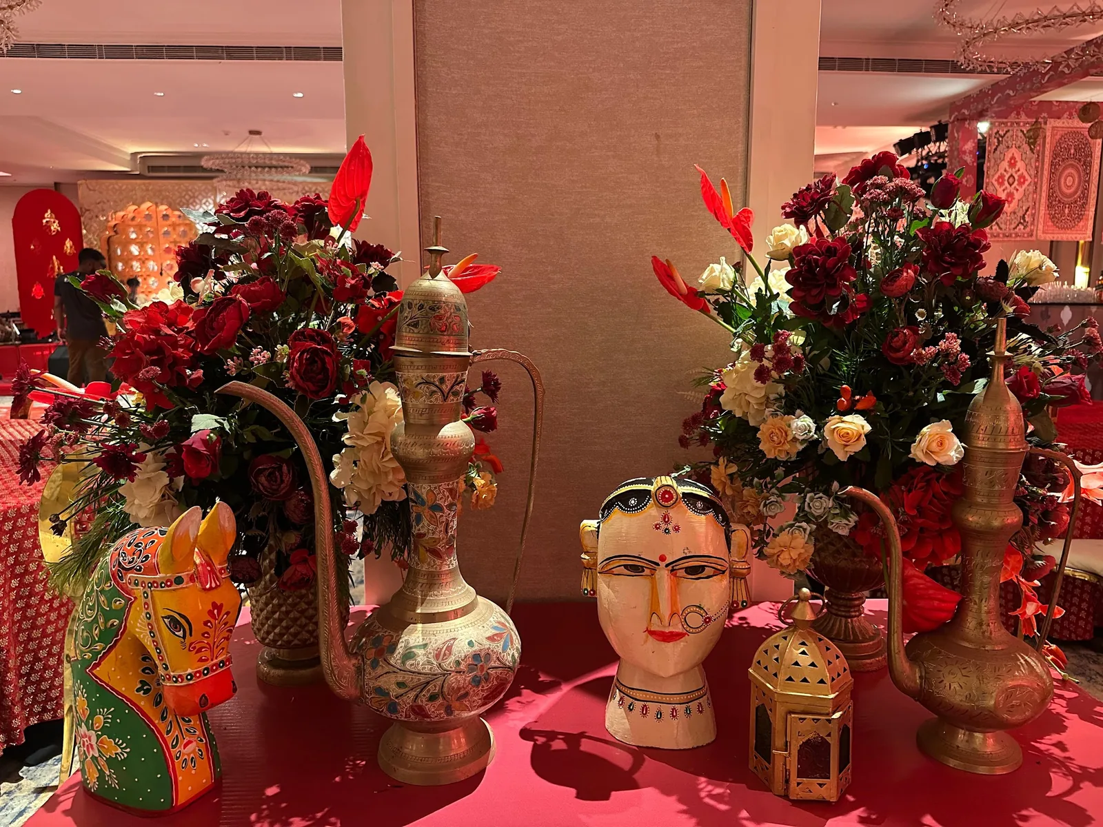 Painted face vases and mixed floral arrangements at The St. Regis Goa Resort
