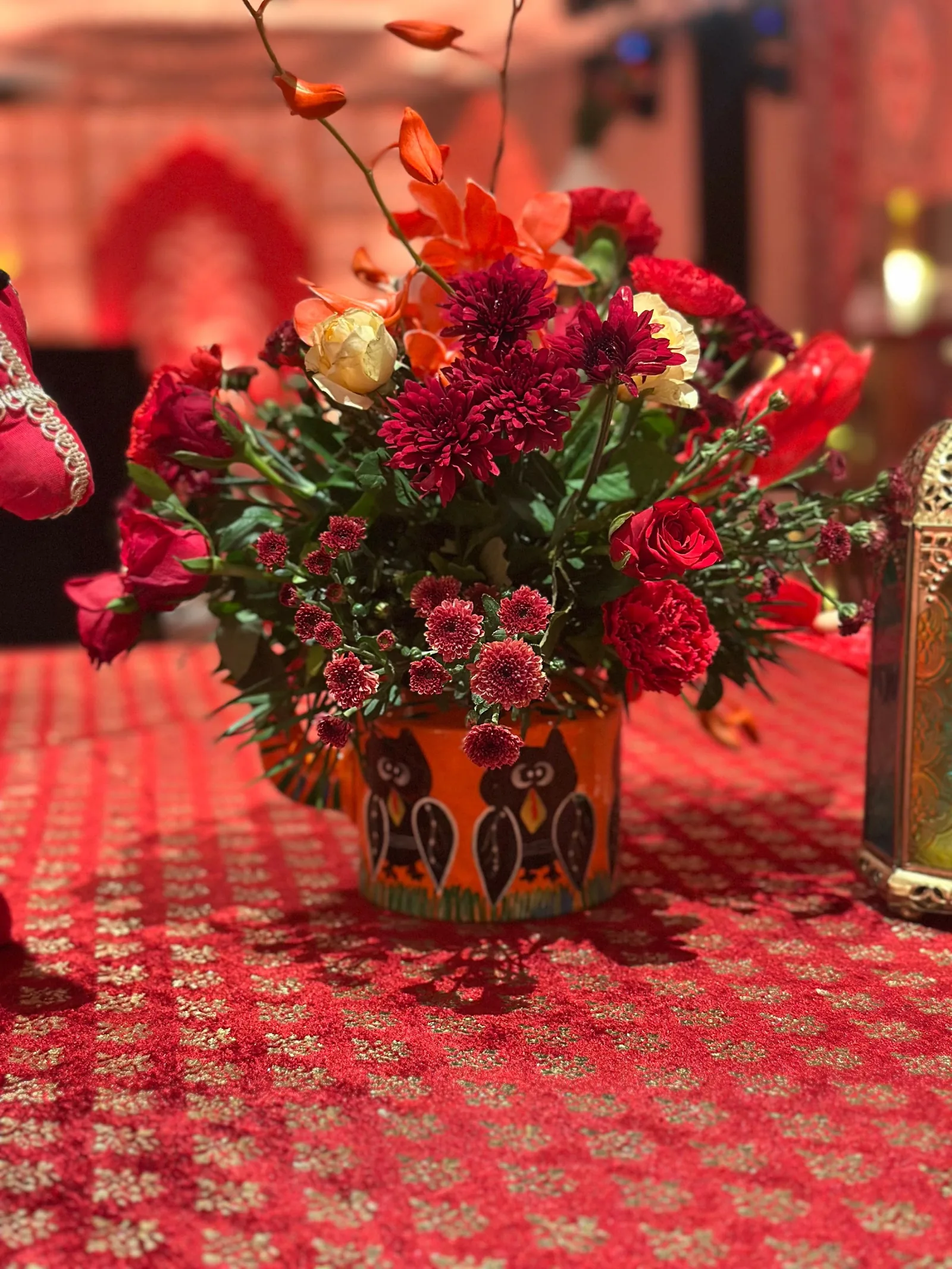 Red flowers in a painted vase at The St. Regis Goa Resort