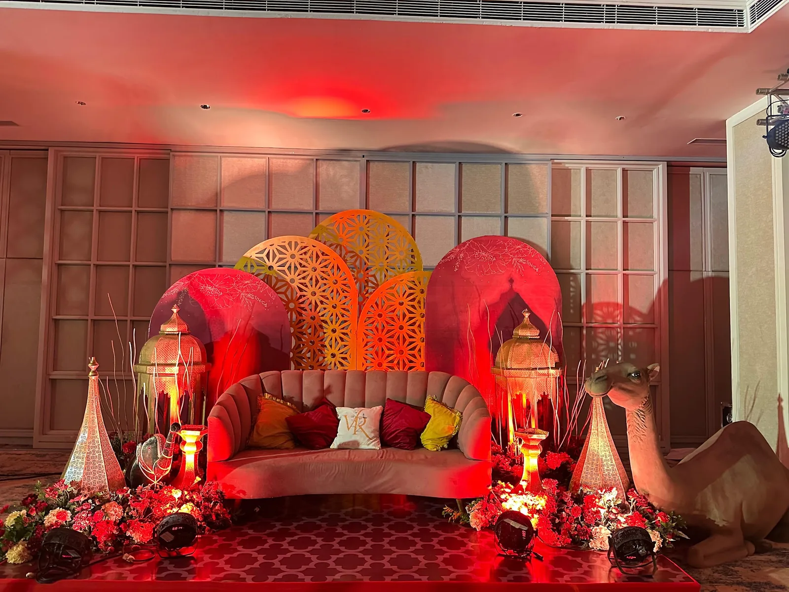 Red lounge seating with glowing lanterns at The St. Regis Goa Resort