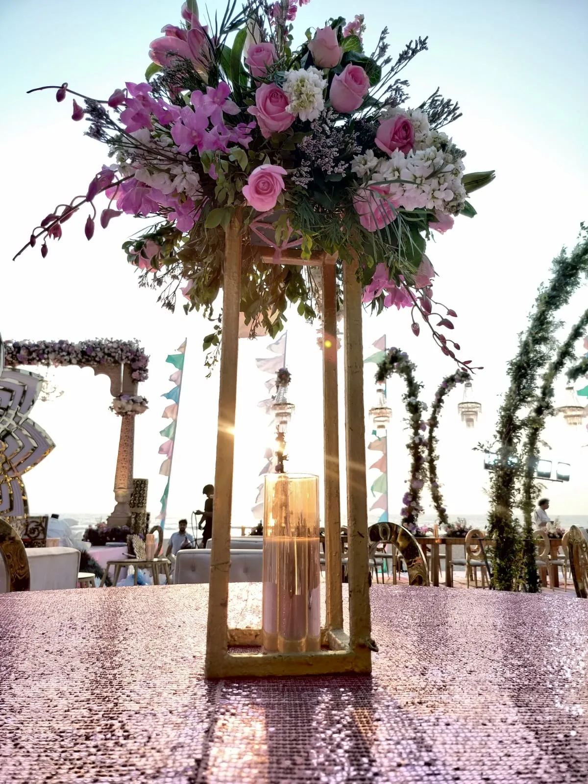 Tall floral pedestal beside the ceremony seating at The St. Regis Goa Resort