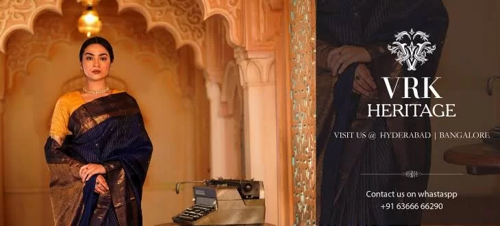 VRK Heritage store banner: a woman in a navy silk saree with a gold border in a heritage interior