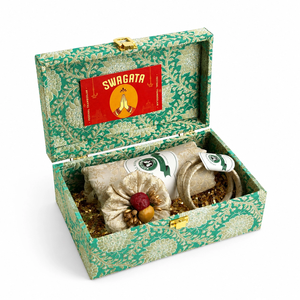 Teal brocade thamboolam box holding folded brocade fabric, a bangle and a haldi-kumkum pouch