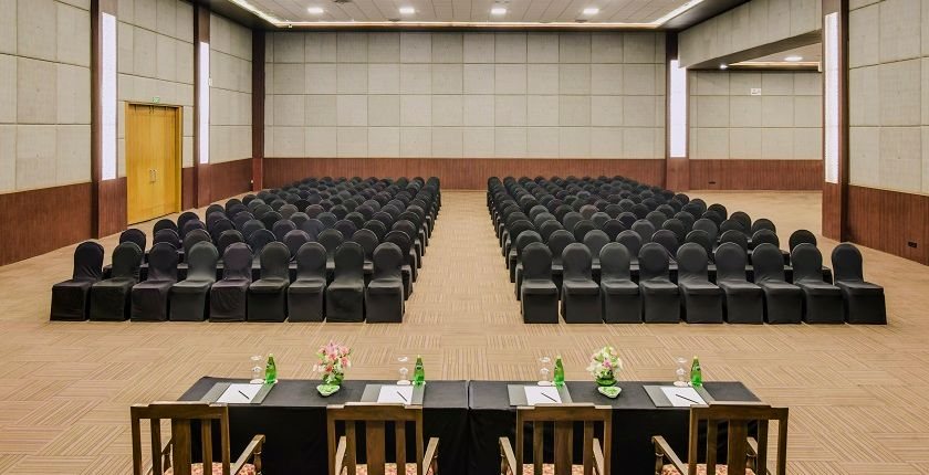 Siddhartha at The LaLiT Ashok Bangalore set theatre-style with black chairs facing a long head table