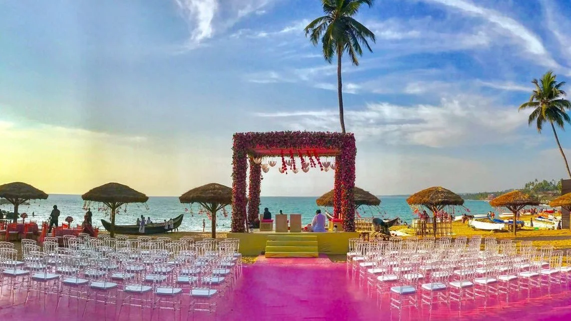 Kerala garden lawn wedding ceremony with white floral drapes — representative image