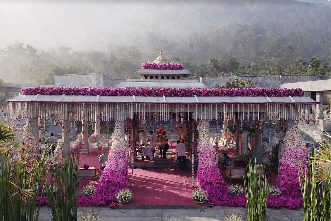 Cascading pink and magenta floral mandap at Amita Rasa with the Nandi Hills in morning mist, by Panigrahana Weddings