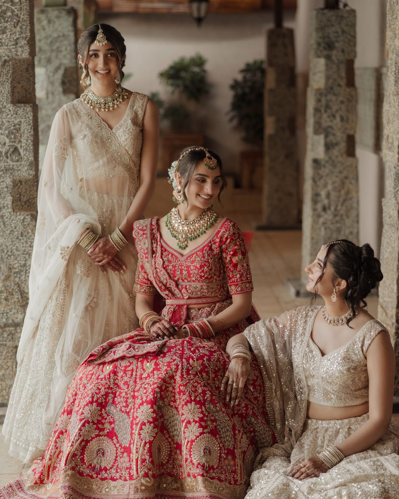 Bride in a red bridal lehenga at a Panigrahana-designed wedding at Amita Rasa, Nandi Hills