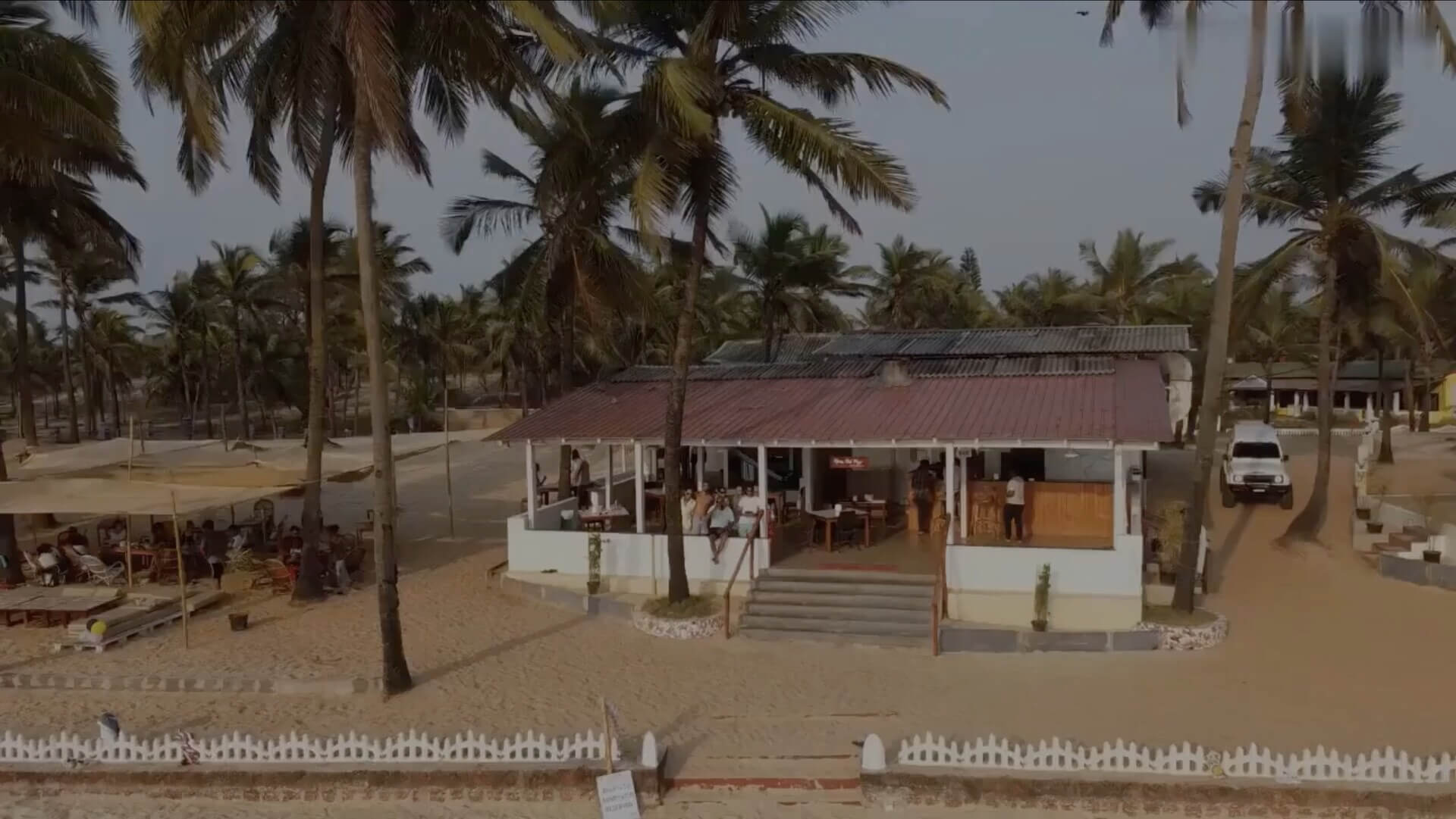 Beachfront buildings and palms at C Roque Beach Resort in Colva, Goa