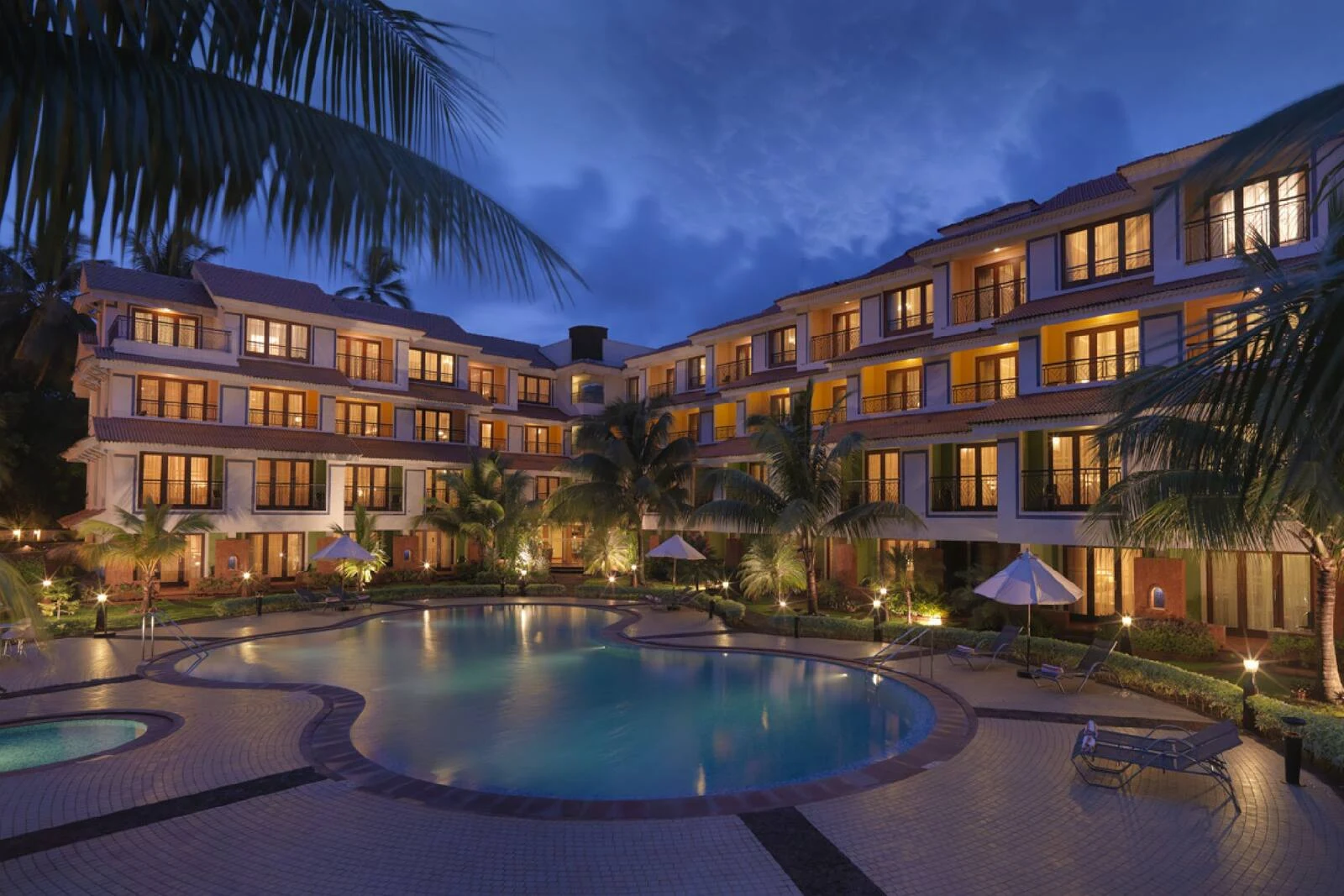 DoubleTree Goa Arpora Baga pool and exterior
