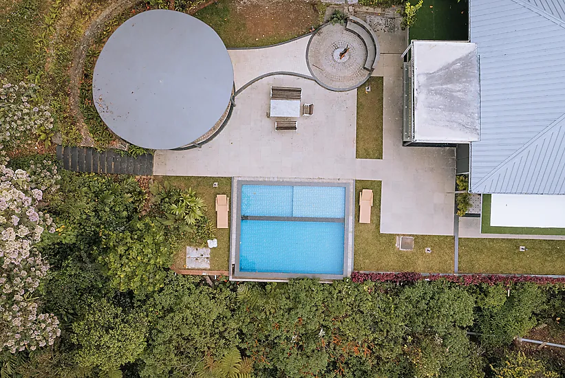 Overhead view of the pool and buildings at Elixir Woods Resort and Spa Munnar