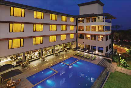 Pool and facade at The Fern Kadamba Hotel and Spa Goa