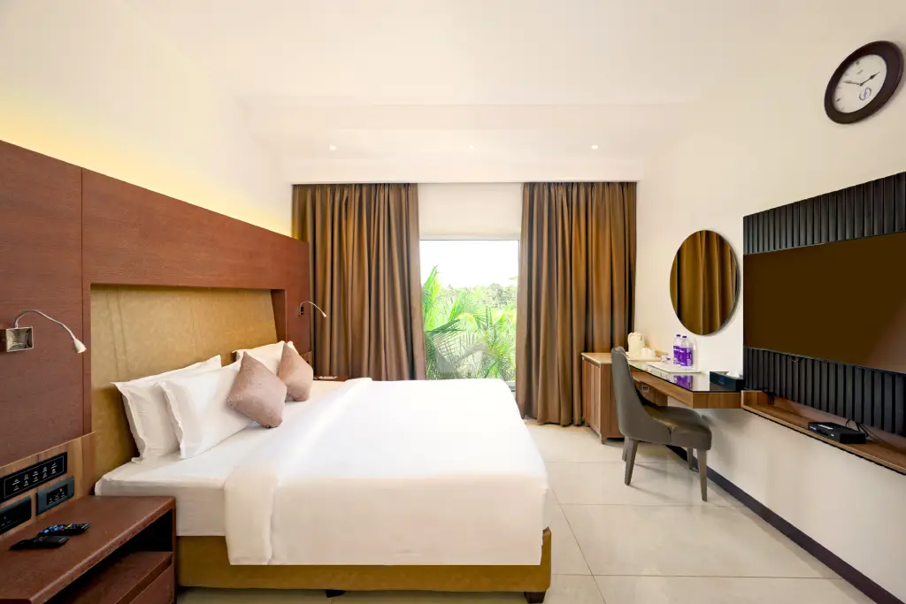 Deluxe King room at Flora Airport Hotel and Convention Centre in Kochi