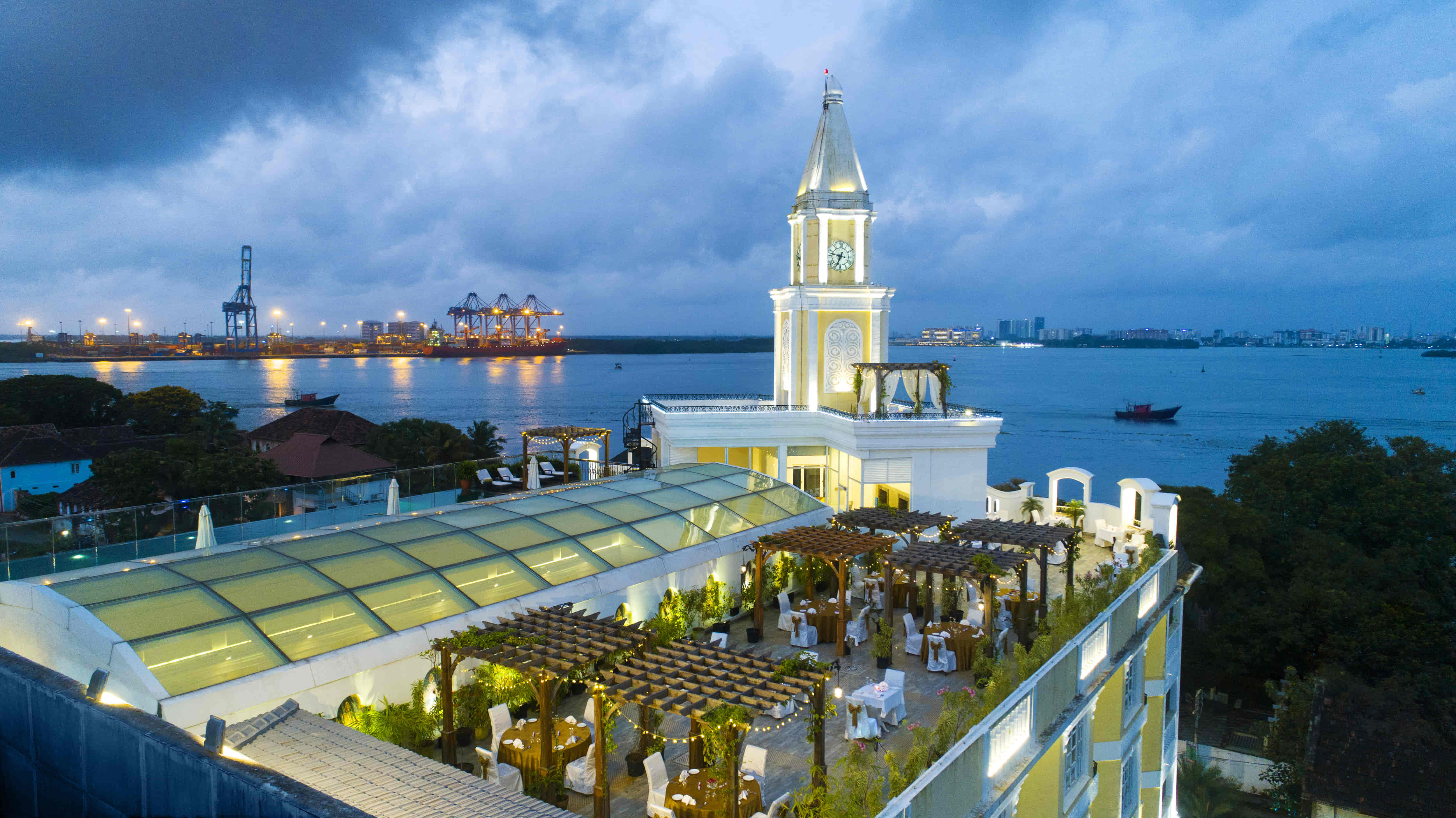 Clock tower and rooftop setting at Fragrant Nature Kochi