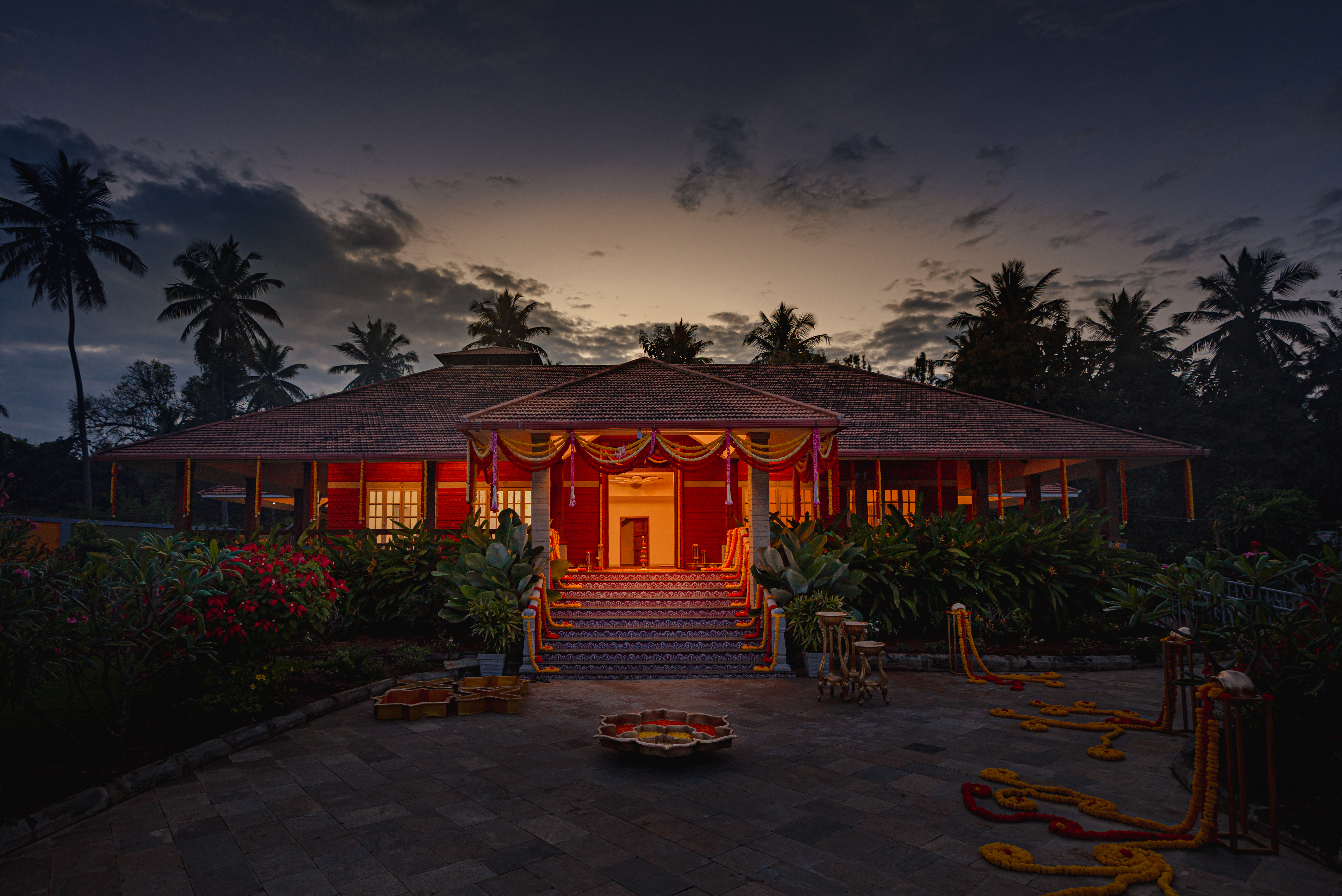 Illuminated entrance and tiled-roof venue at Geethanjali, Tharalu, Bangalore