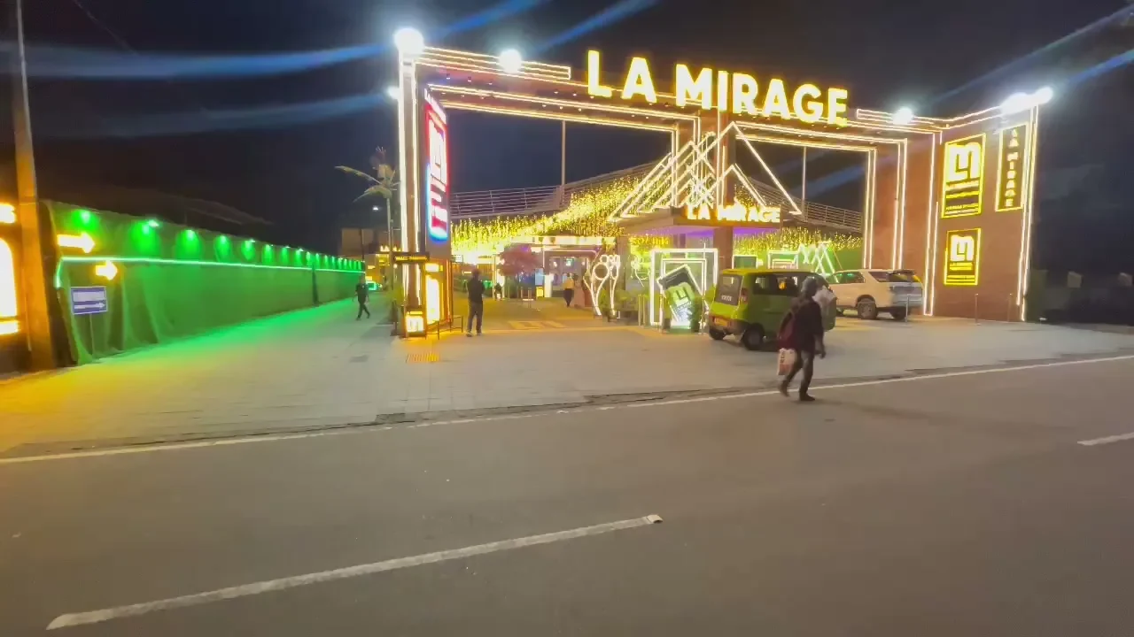 Illuminated entrance at LA Mirage wedding venue, Koratty