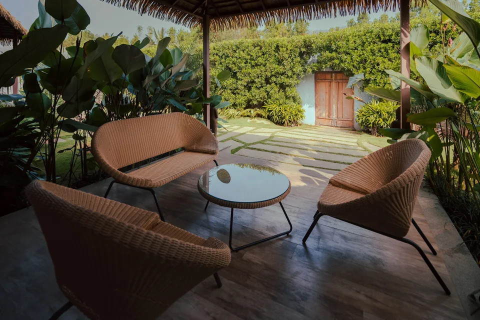 Sheltered outdoor lounge overlooking the garden at ORO Garden Villa