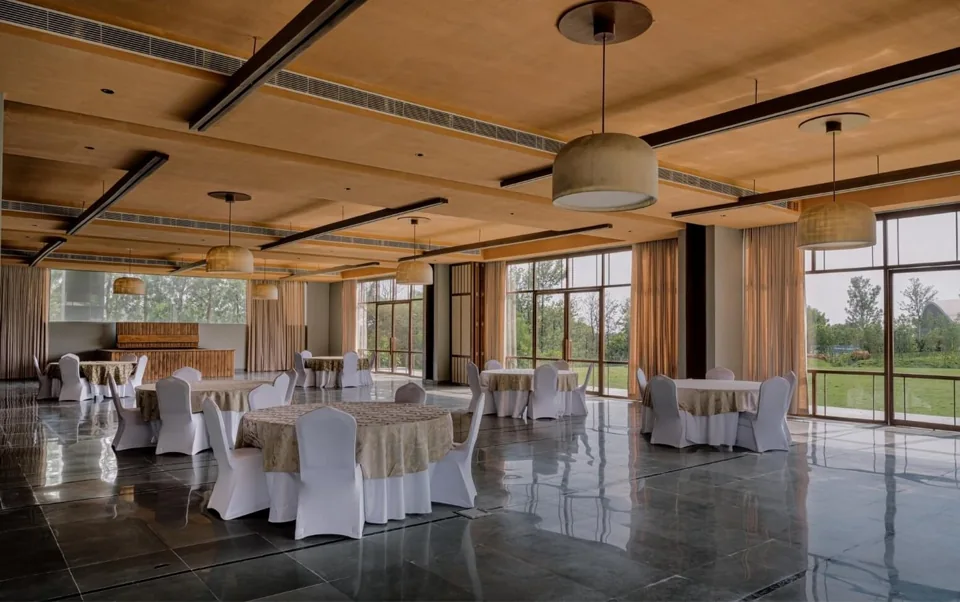 Infinity Hall at ORO with timber ceiling, banquet tables and doors to the lawn