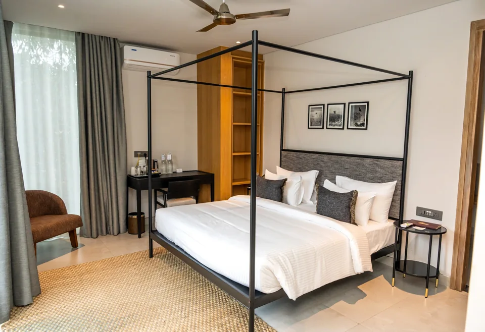 Four-poster bed in a bedroom at ORO Sanctuary Villa