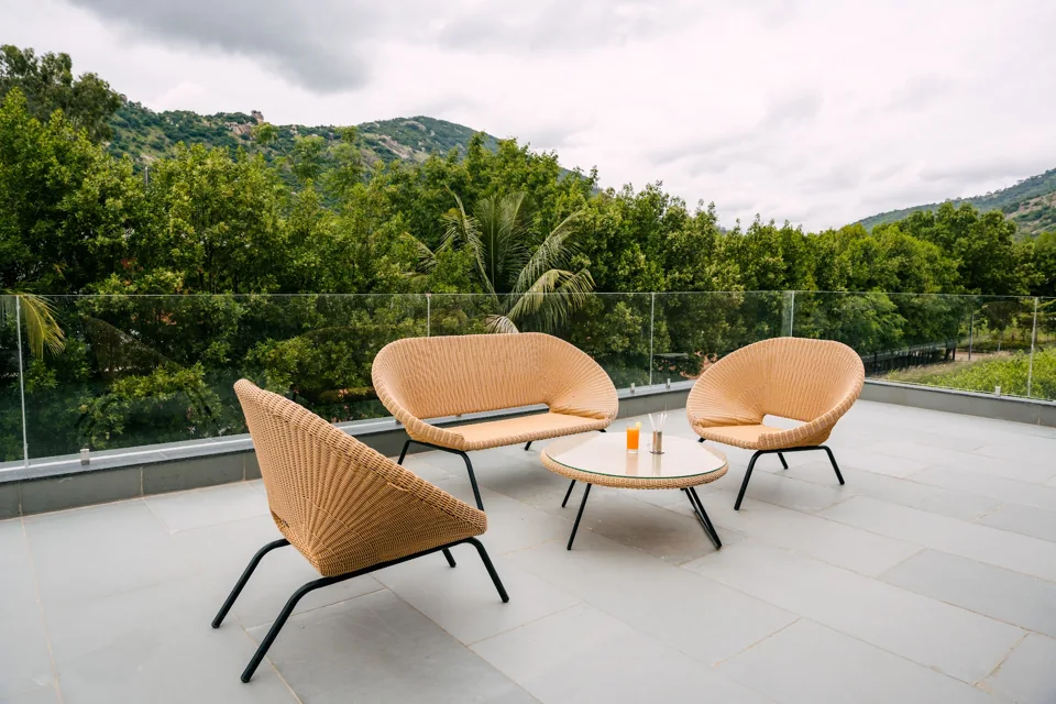 Terrace seating with a view of the Nandi Hills at Sanctuary Villa