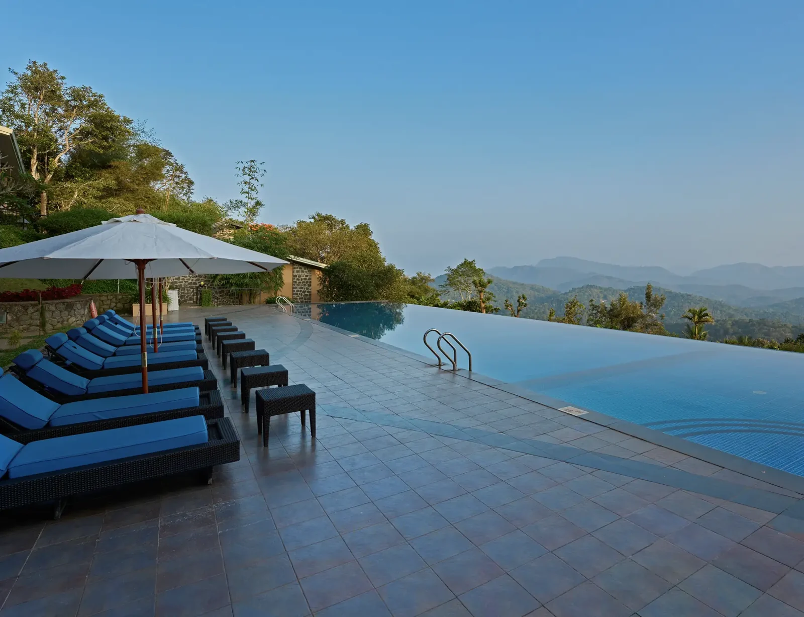 Infinity pool and terrace at Poetree Resort in Thekkady