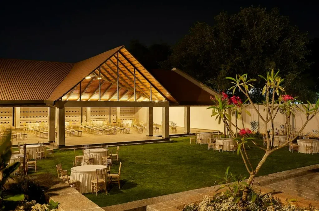 Timber-roofed event pavilion and lawn at Samavana Halls & Gardens, Yelahanka