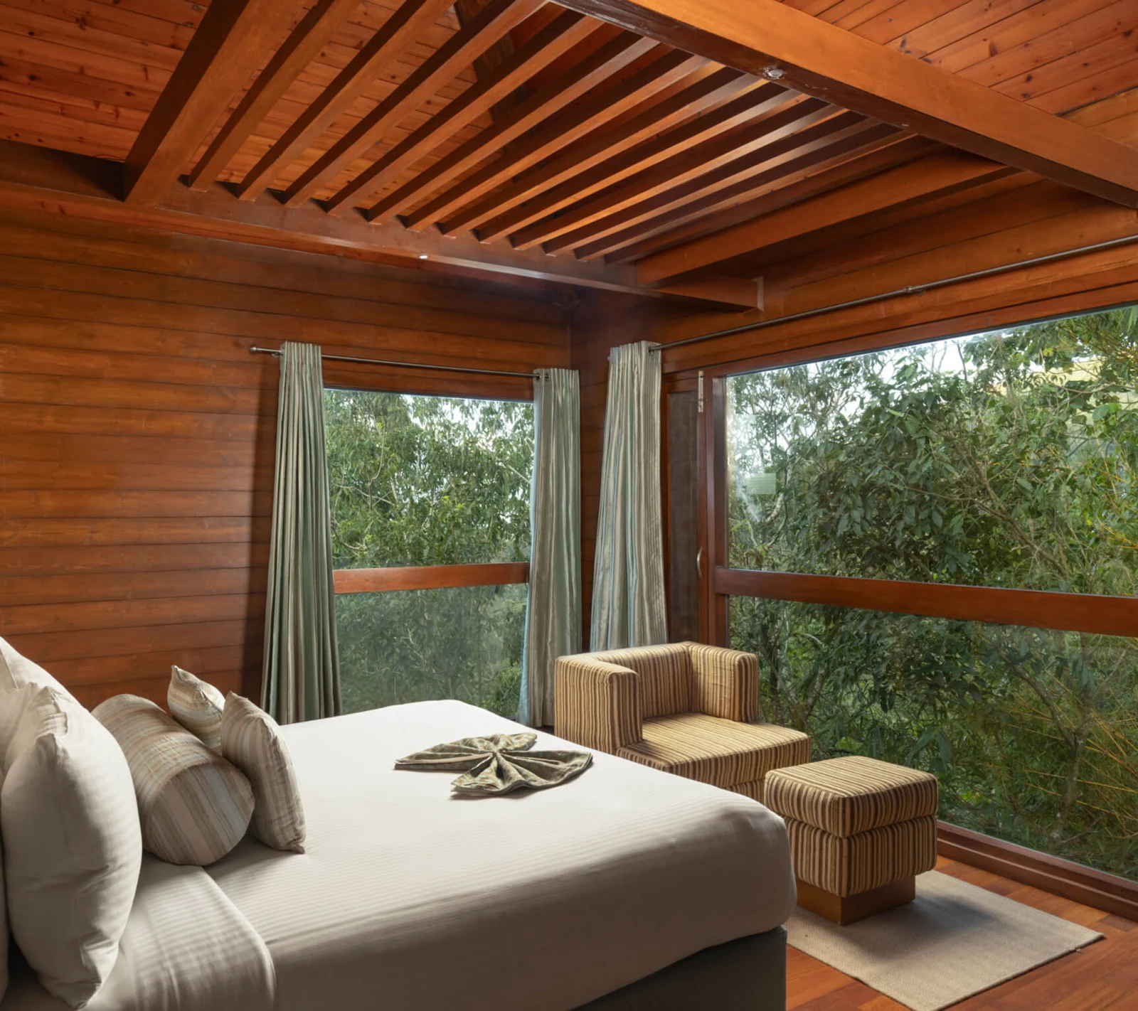 Timber suite cottage interior at The Tamara Coorg