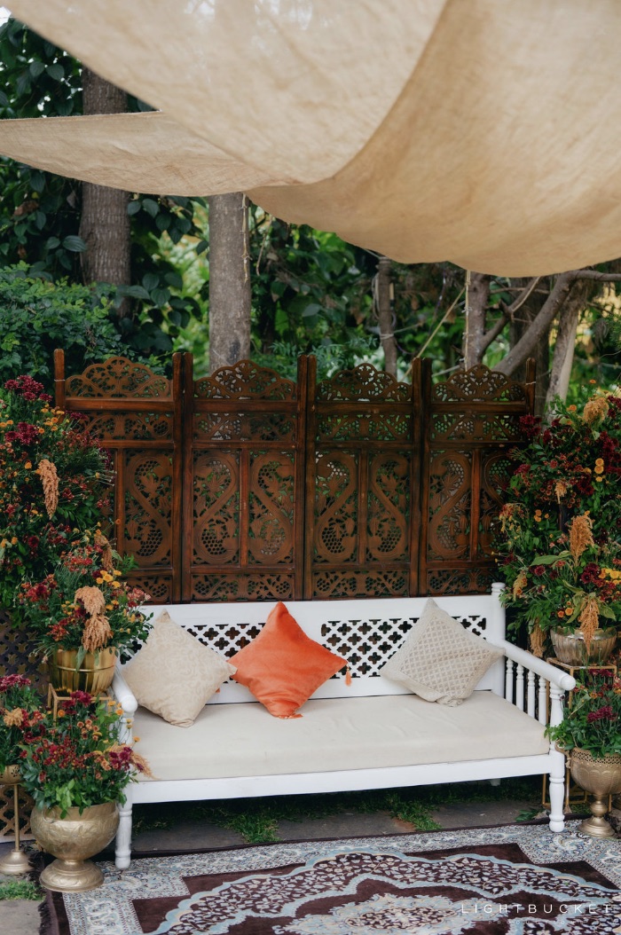 Carved screen and seating corner in the grounds at Nature Knots