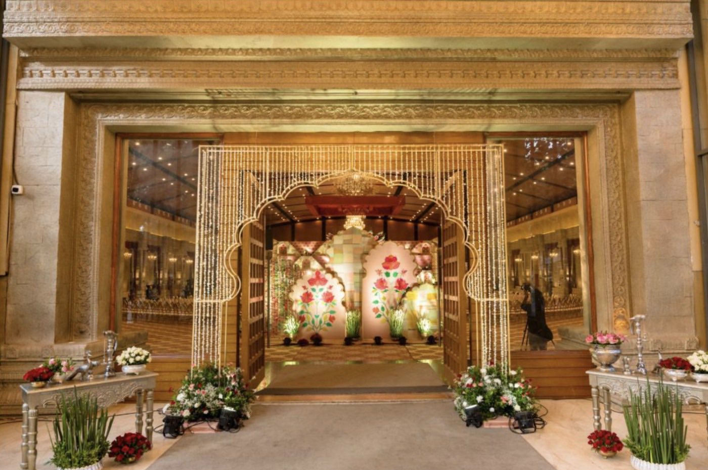 Entrance to Mukta Hall at Chamara Vajra Bangalore dressed in light curtains, framing the fabric stage inside